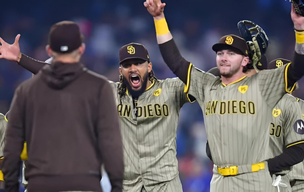 The Padres hit a game-winning triple to upset the Dodgers and clinch a playoff berth.