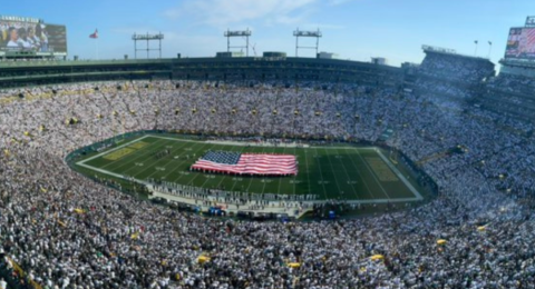 Fans in white suits cheered on the Packers during the “Winter Alert” game